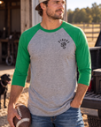 The Brand Baseball Tee in Envy/Premium Heather — male model, front view