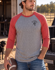 The Brand Baseball Tee in Vintage Red/Premium Heather — male model, front view