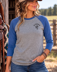 The Brand Baseball Tee in Vintage Royal/Premium Heather — female model, front view