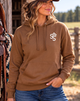 The Brand Hoodie in Saddle — female model, front view