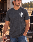 The Brand Tee in Heathered Charcoal — male model, front view