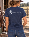 The Brand Tee in Heathered Navy — female model, back view