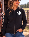 The Branded Zip in Black — female model, front view