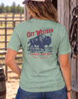 Bison Tee in Heathered Dusty Sage — female model, back view