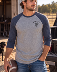 The Brand Baseball Tee in Vintage Navy/Premium Heather — male model, front view