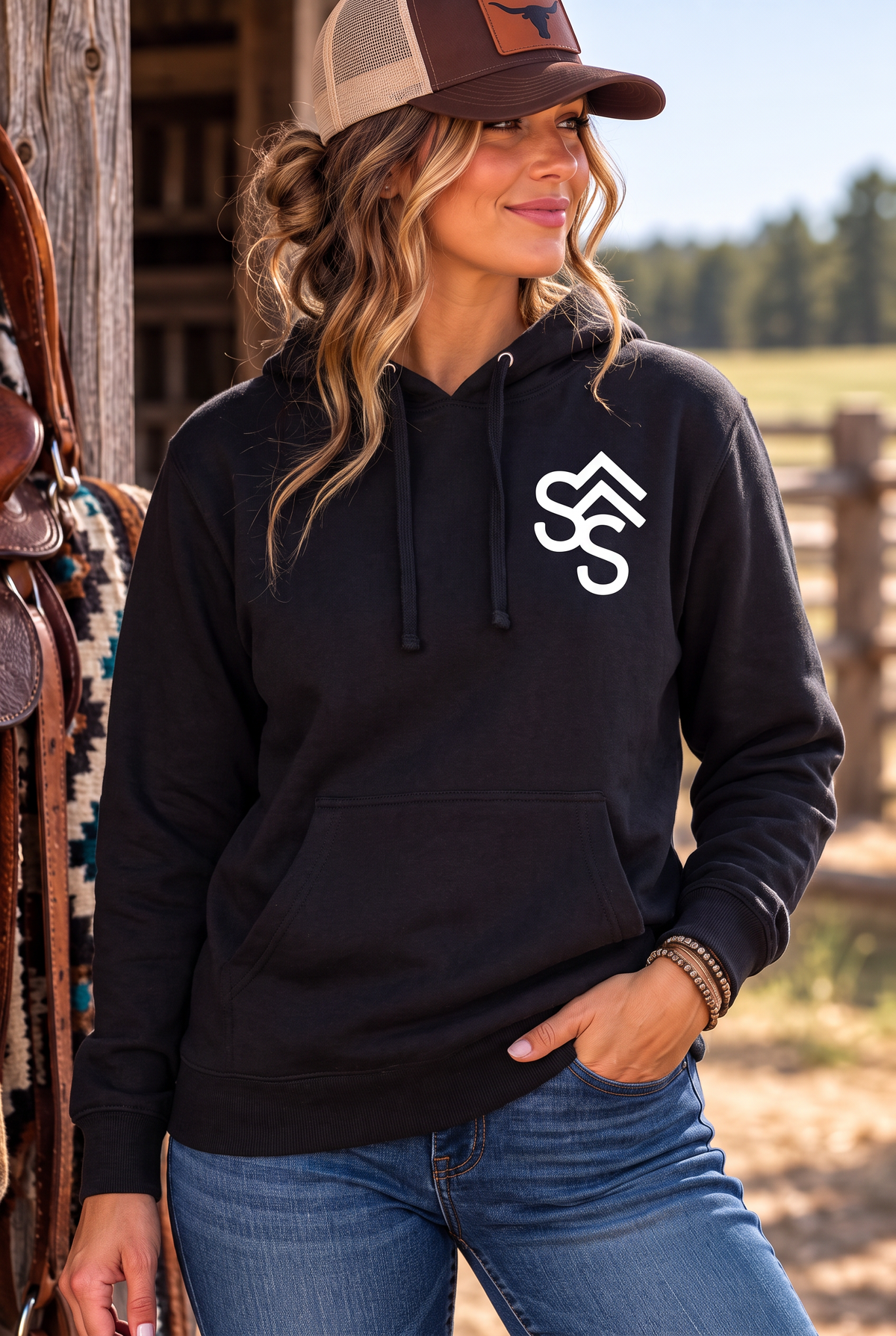 The Brand Hoodie in Black — female model, front view