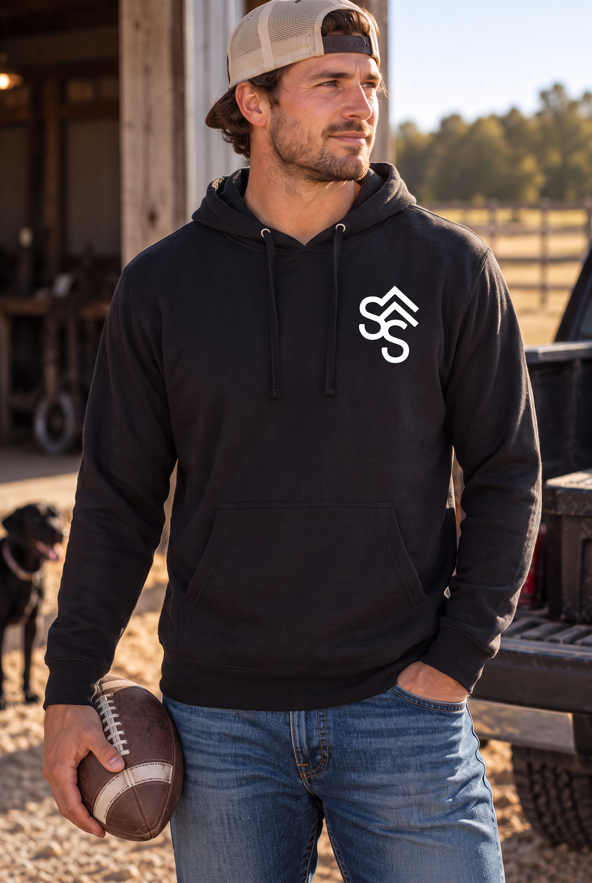 The Brand Hoodie in Black — male model, front view