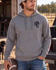 The Brand Hoodie in Gunmetal Heather — male model, front view
