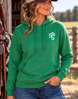 The Brand Hoodie in Kelly Green Heather — female model, front view