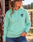 The Brand Hoodie in Mint — female model, front view