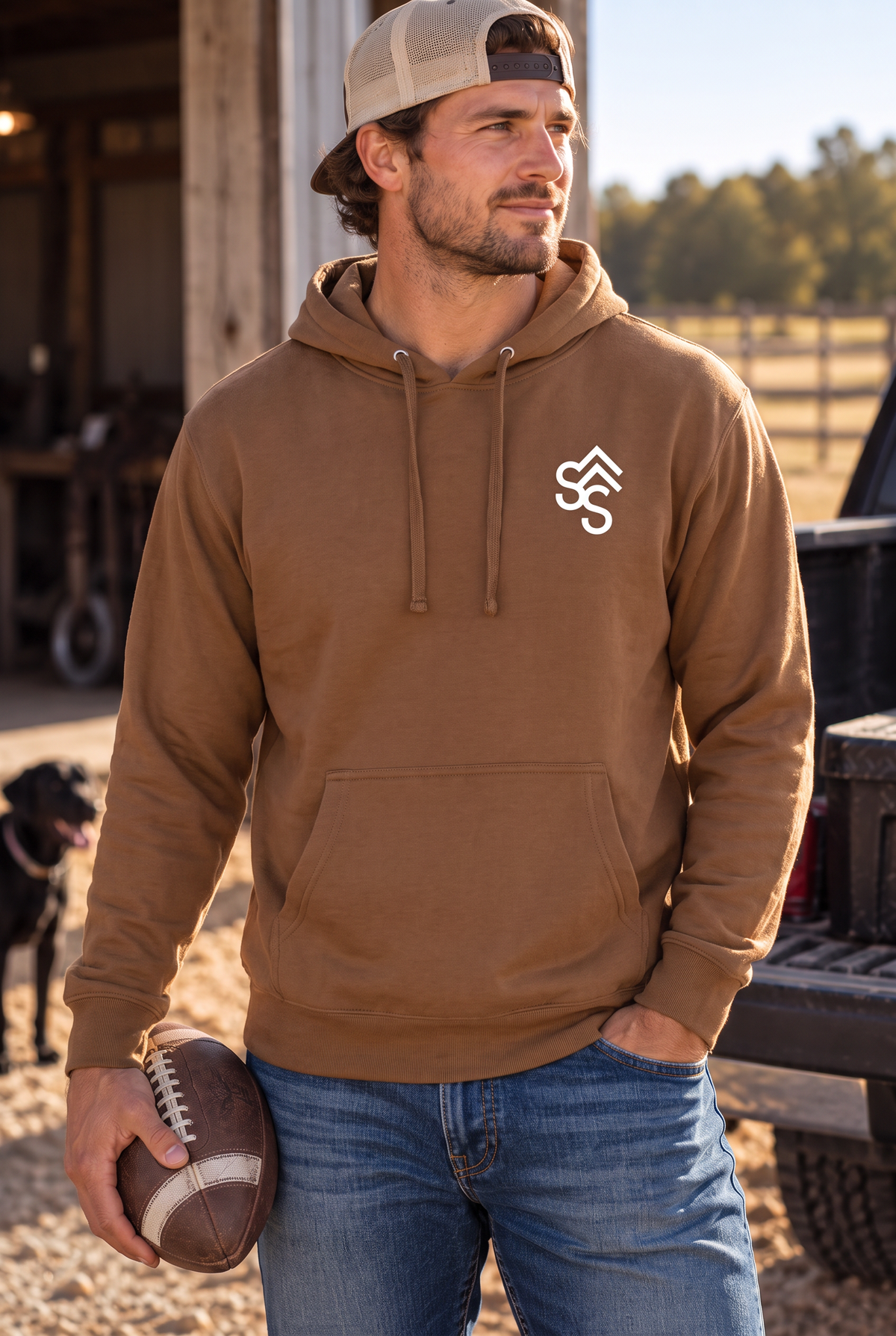 The Brand Hoodie in Saddle — male model, front view