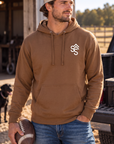The Brand Hoodie in Saddle — male model, front view
