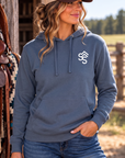 The Brand Hoodie in Storm Blue — female model, front view