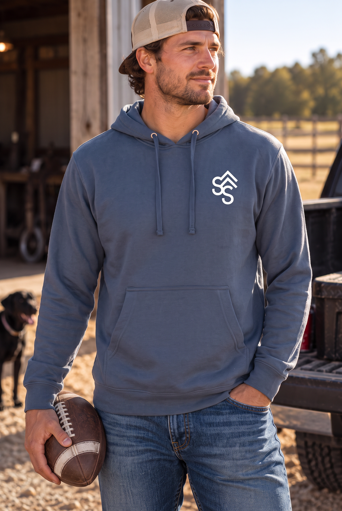 The Brand Hoodie in Storm Blue — male model, front view