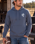 The Brand Hoodie in Storm Blue — male model, front view