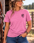 The Brand Tee in Awareness Pink Heather — female model, front view