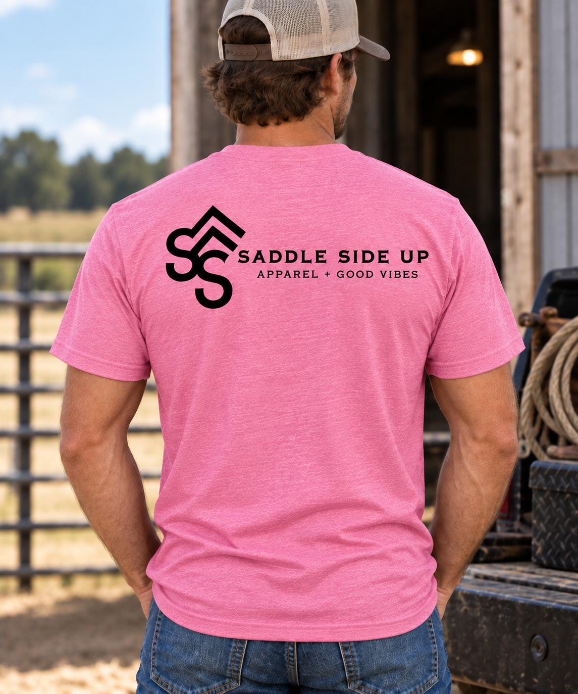 The Brand Tee in Awareness Pink Heather — male model, back view