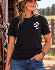 The Brand Tee in Black — female model, front view