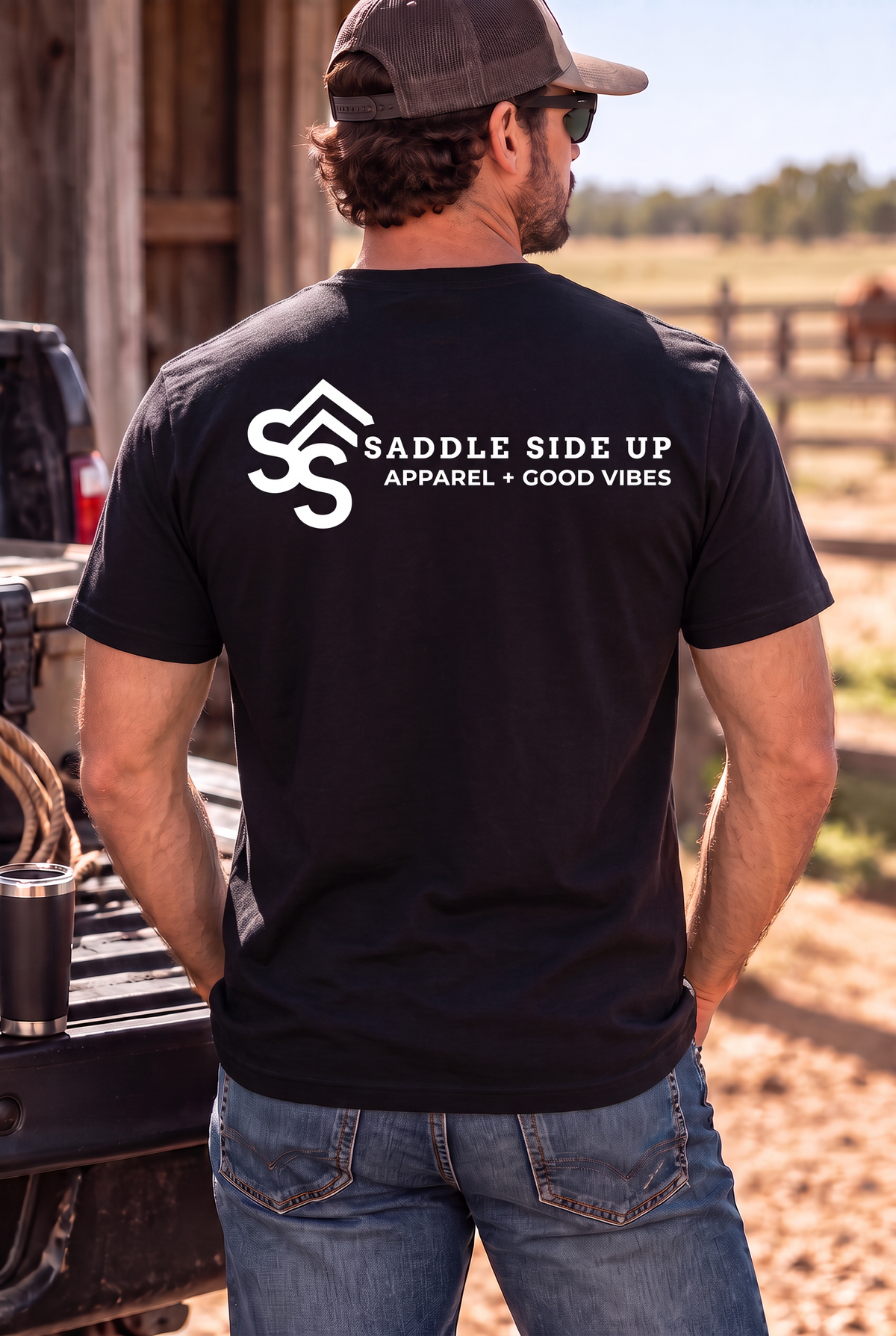 The Brand Tee in Black — male model, back view