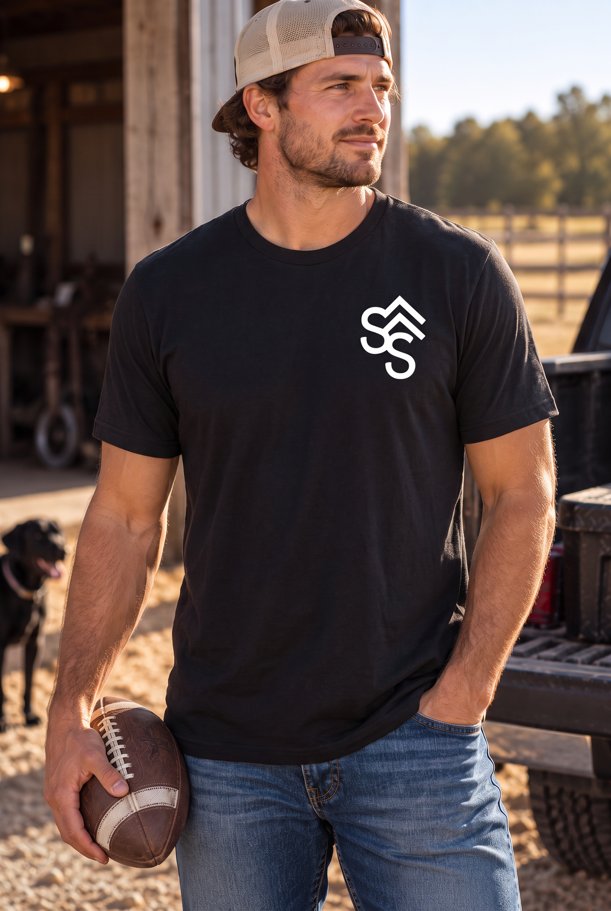 The Brand Tee in Black — male model, front view