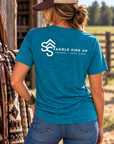 The Brand Tee in Deep Turquoise Fleck — female model, back view