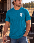 The Brand Tee in Deep Turquoise Fleck — male model, front view