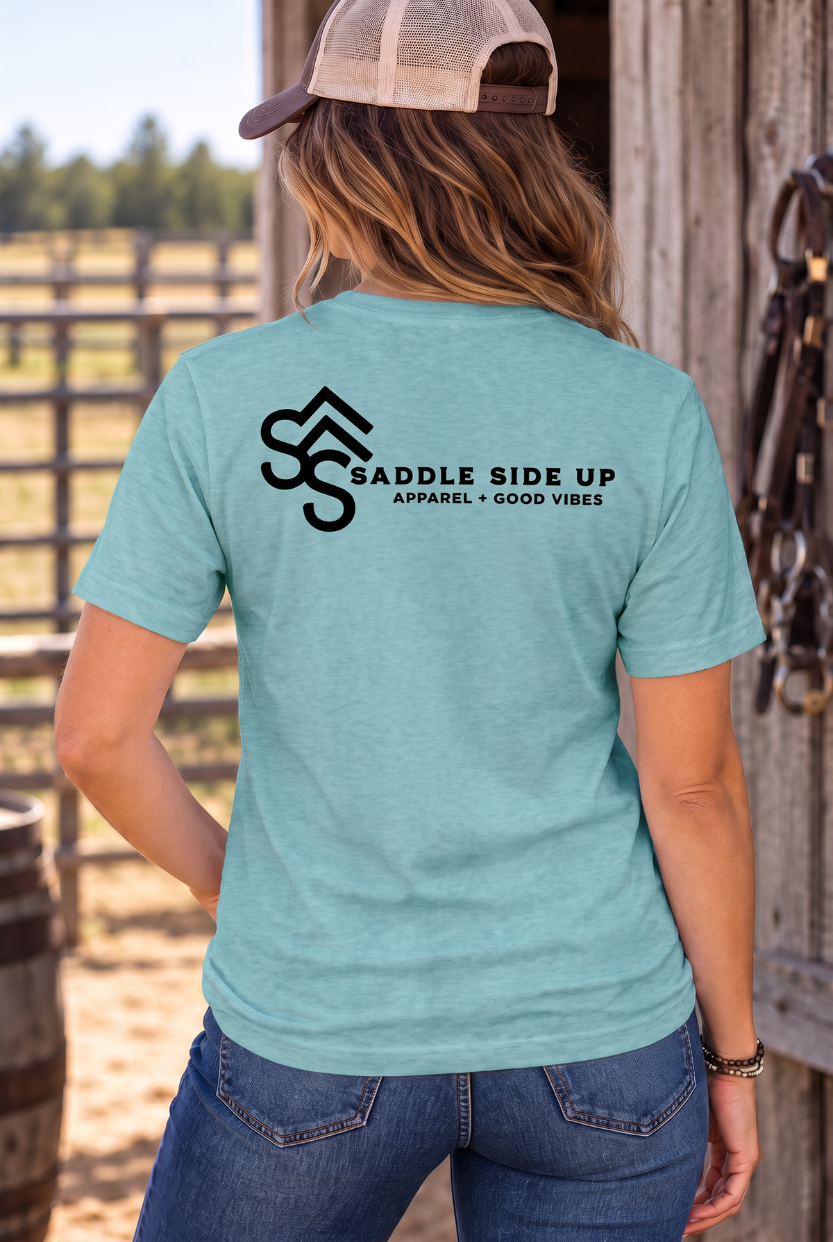 The Brand Tee in Heathered Eucalyptus Blue — female model, back view