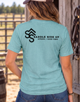 The Brand Tee in Heathered Eucalyptus Blue — female model, back view