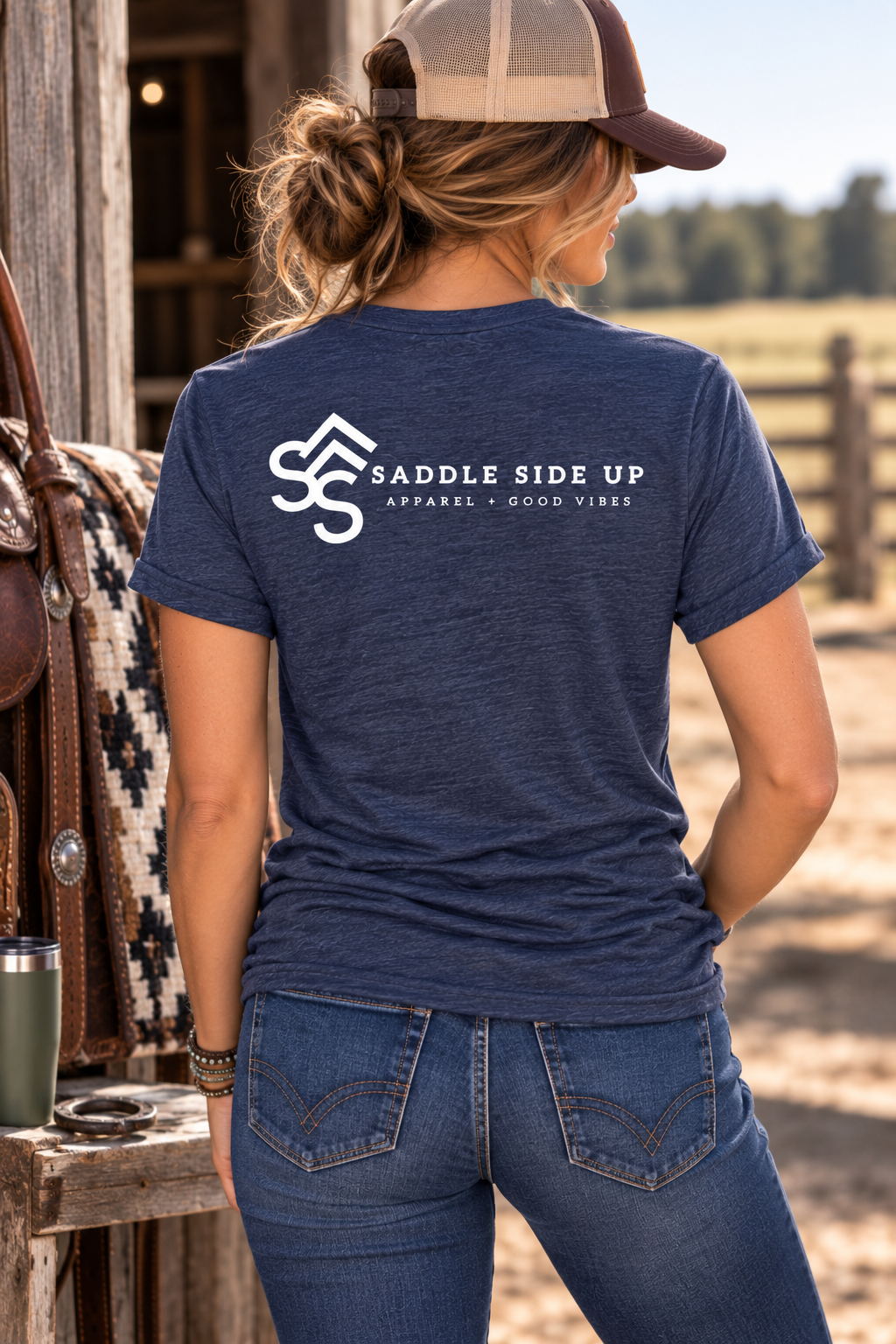 The Brand Tee in Heathered Navy — female model, back view