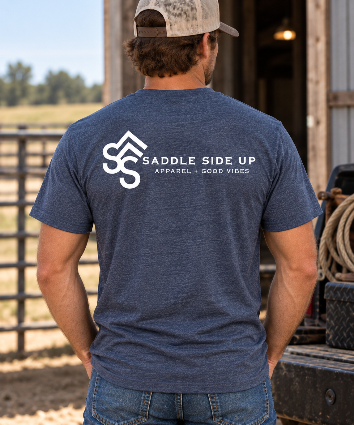 The Brand Tee in Heathered Navy — male model, back view