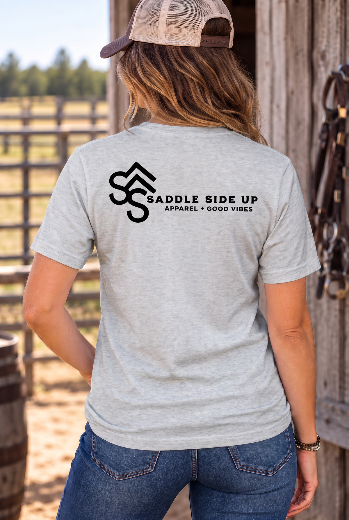 The Brand Tee in Light Heather Grey — female model, back view