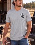 The Brand Tee in Light Heather Grey — male model, front view