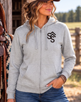 The Branded Zip in Light Heather Grey — female model, front view