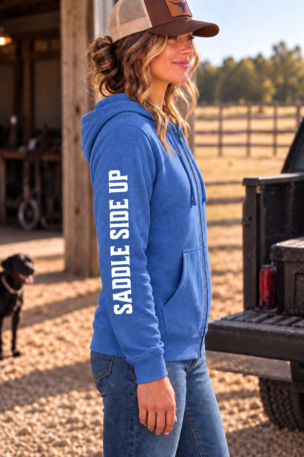 The Branded Zip in Royal Frost — female model, side view showing SADDLE SIDE UP sleeve print